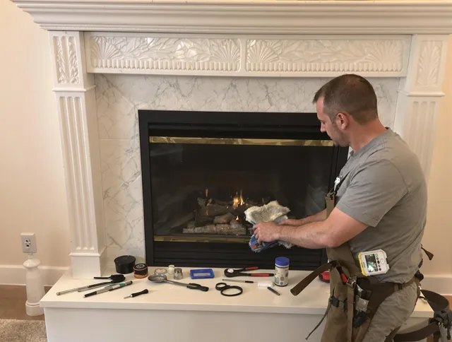 Worthington Chimney Sweep performing fireplace maintenance in Worthington, OH