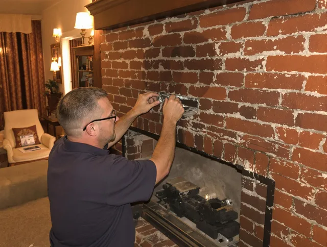 Worthington Chimney Sweep expert fixing a fireplace in Worthington, OH